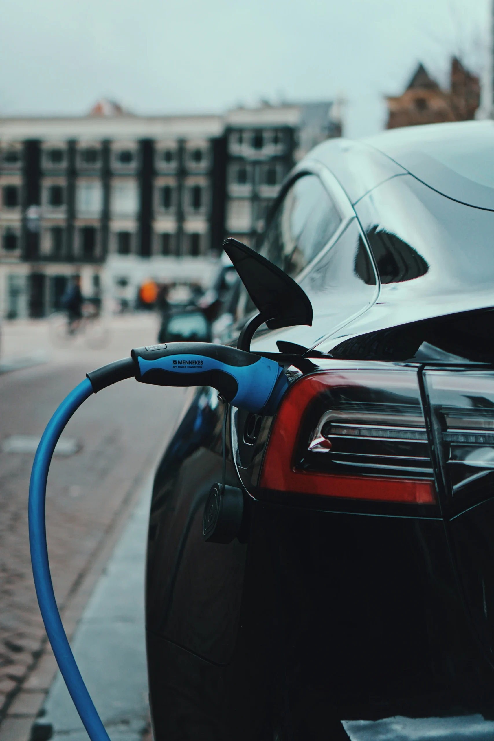 Technician performing electric car repair in Los Angeles garage